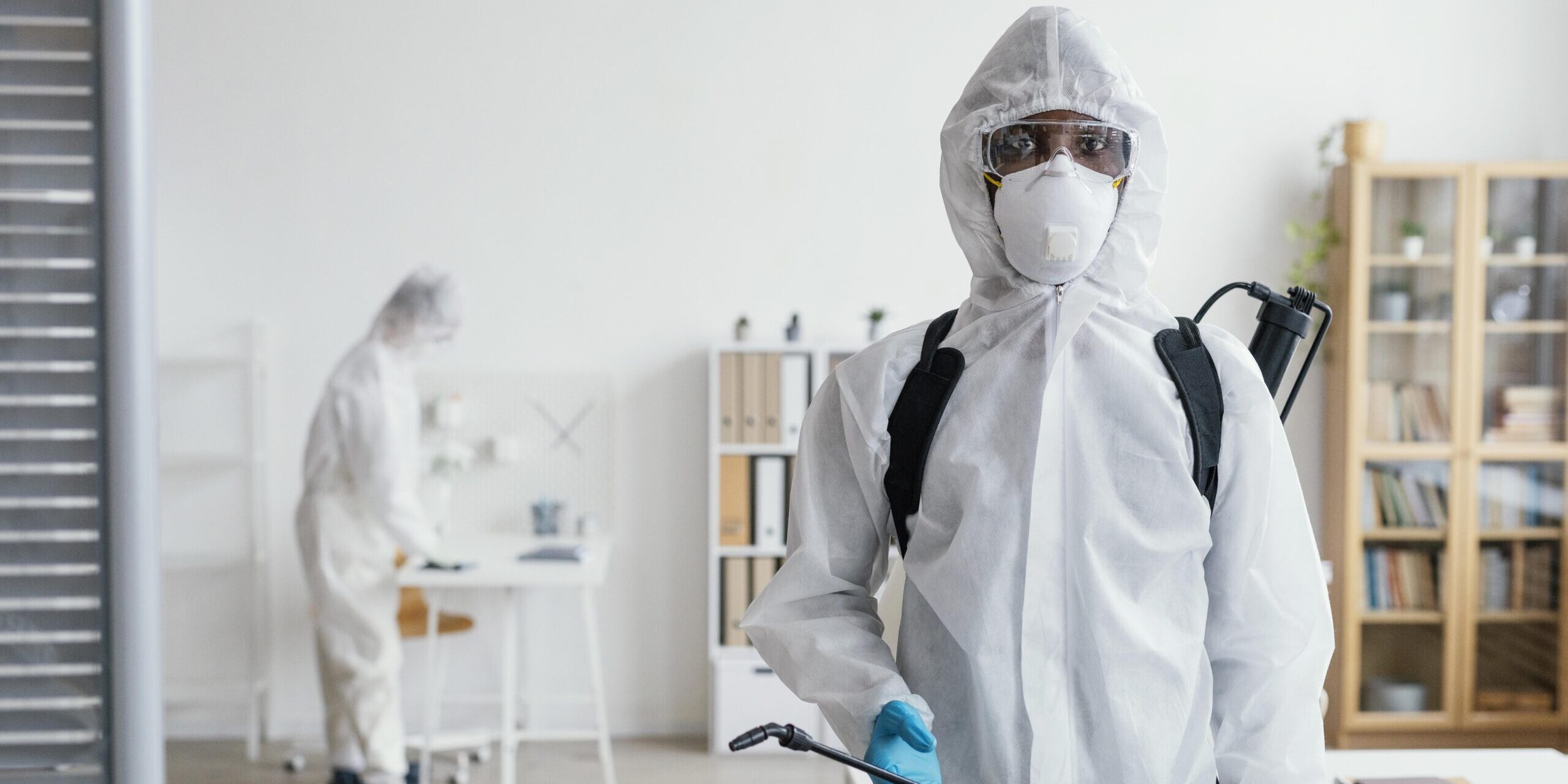 A man in a protective cloth for pest control