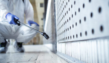 A picture of a man spraying pesticide